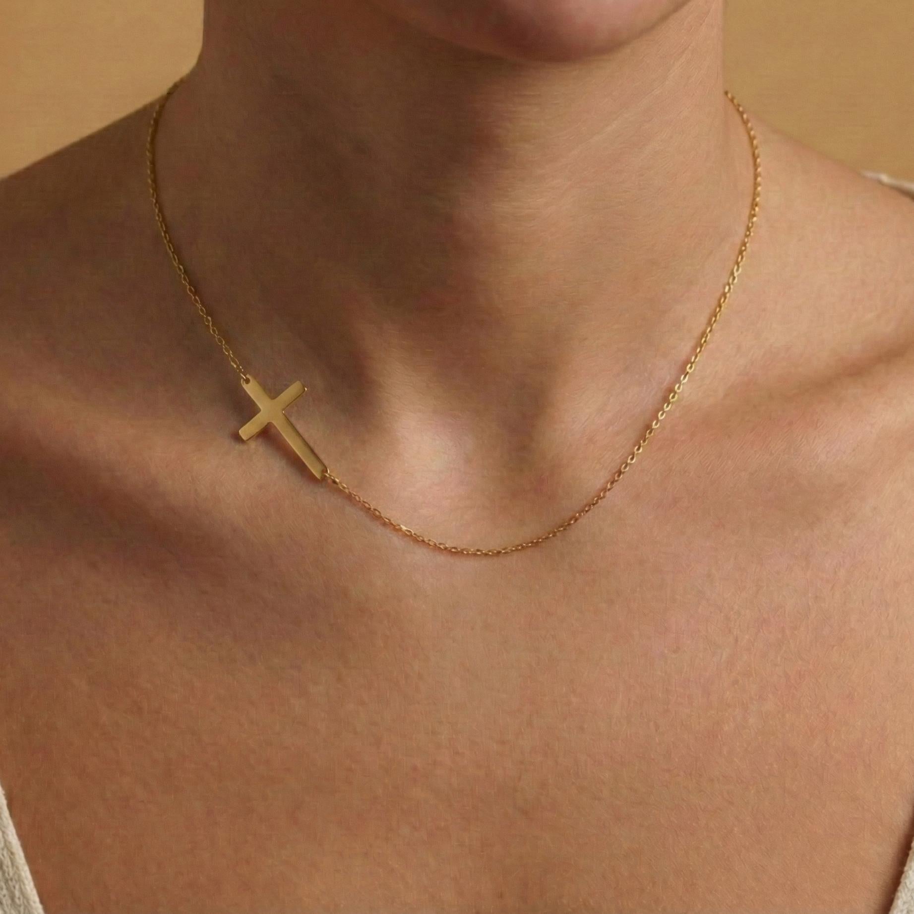 Minimalist sideways cross necklace in 14k gold plated on model, off center horizontal cross pendant for women, dainty religious confirmation gift