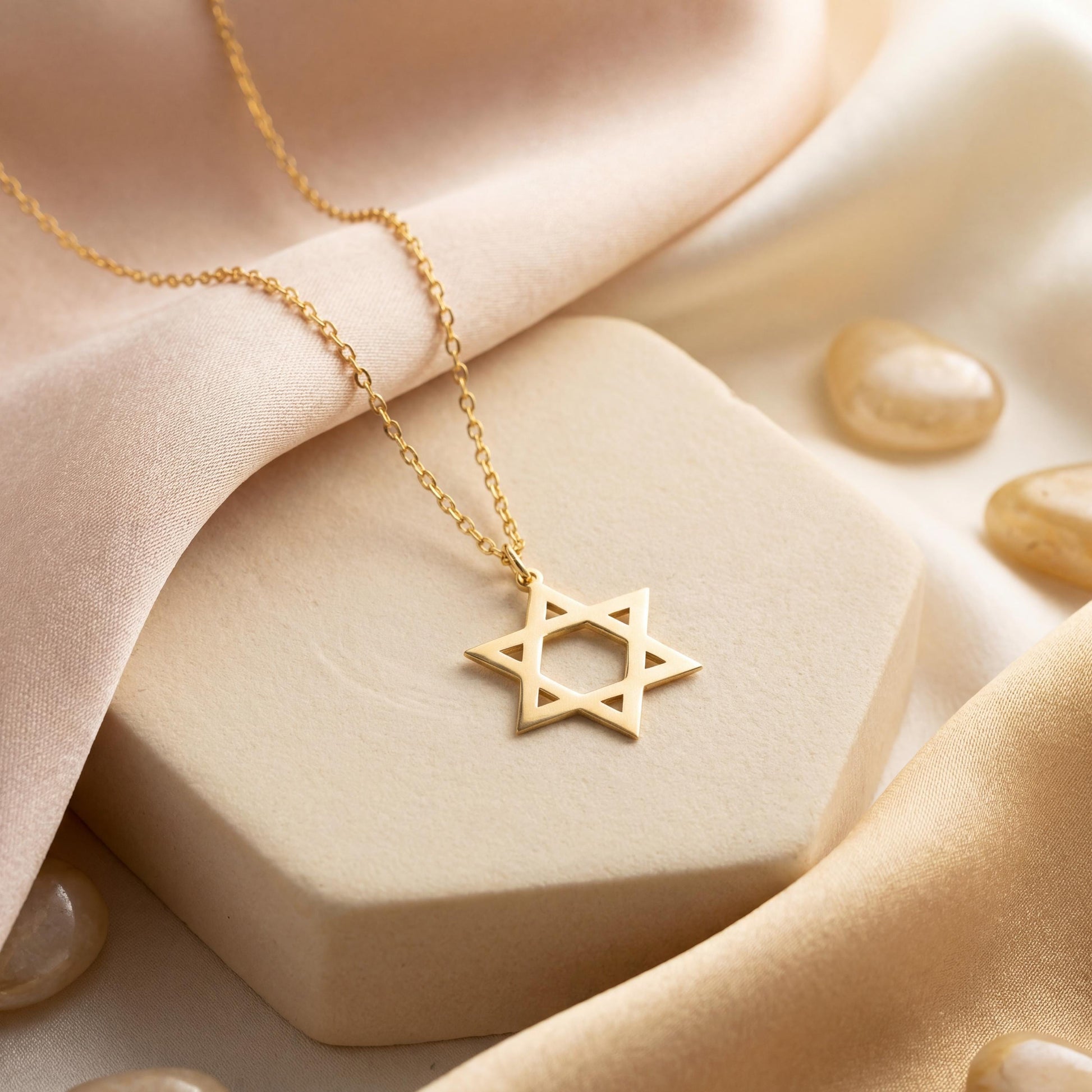 Minimalist gold Star of David pendant necklace on a woman's neck, dainty Magen David Jewish jewelry gift for Bat Mitzvah and Mother's Day.