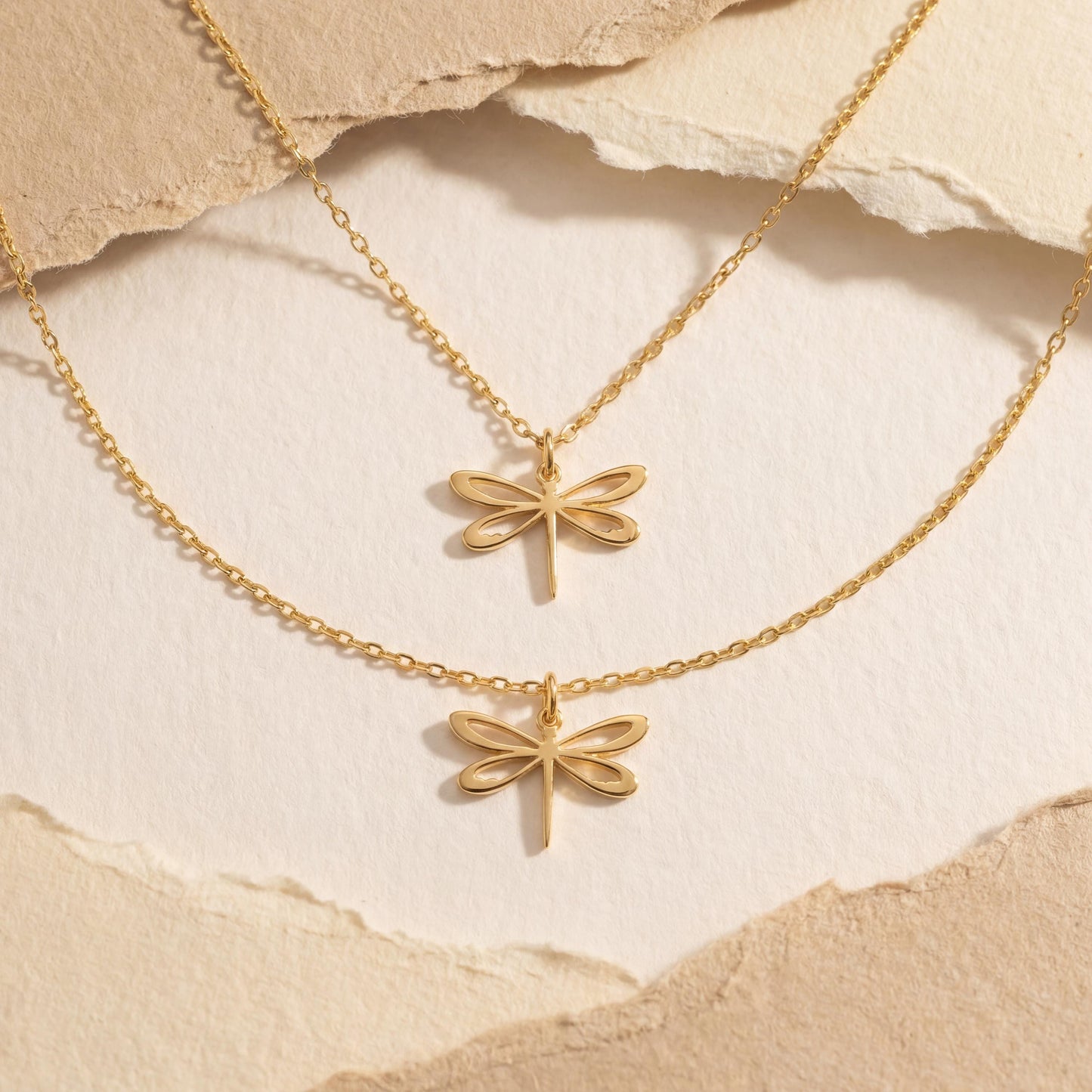 Minimalist 14K gold plated dragonfly necklace worn by a blonde woman, delicate insect pendant resting on collarbone, elegant Mother's Day jewelry gift idea.