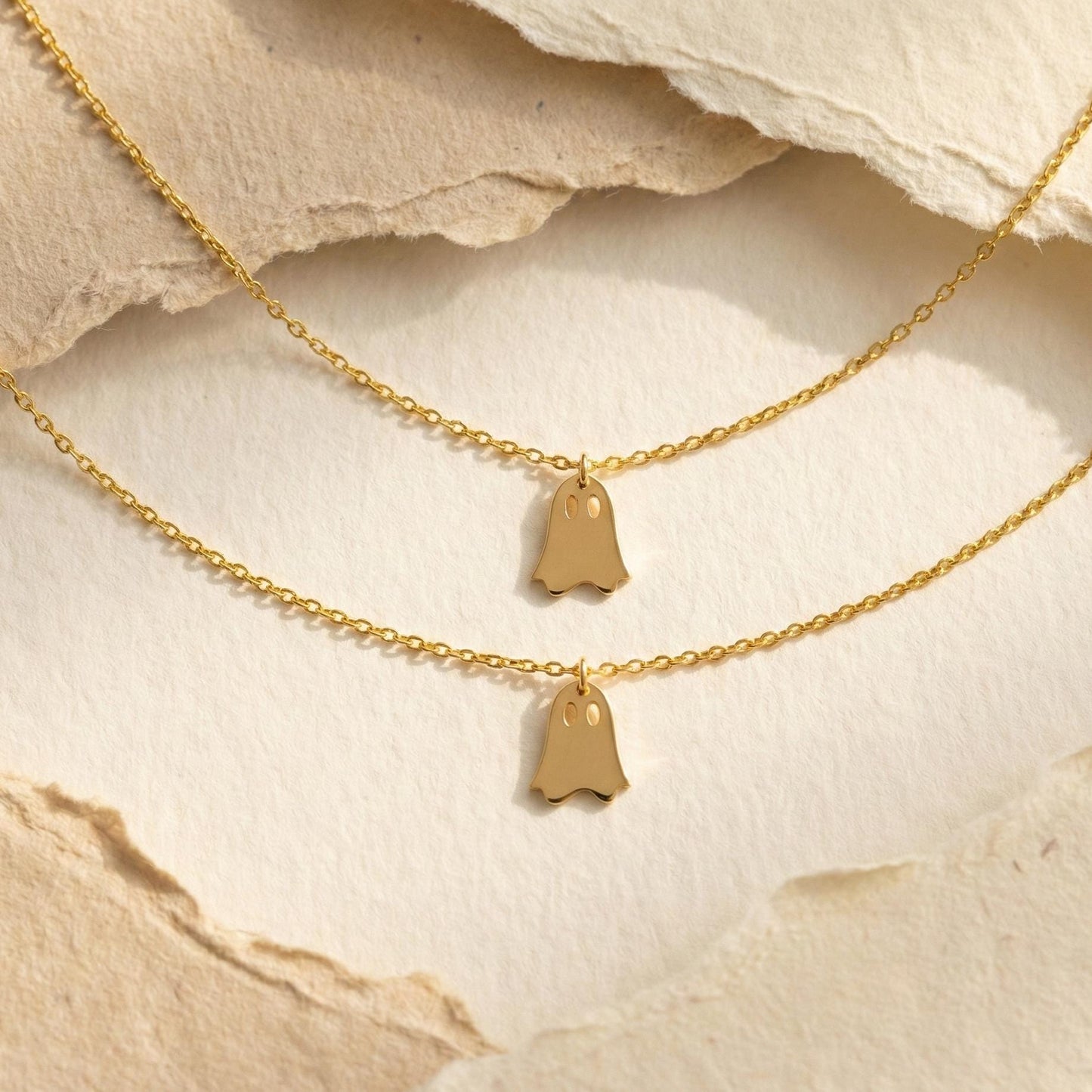 Minimalist gold ghost necklace pendant on a model, cute spooky mama jewelry gift for mothers day, dainty charm necklace aesthetic