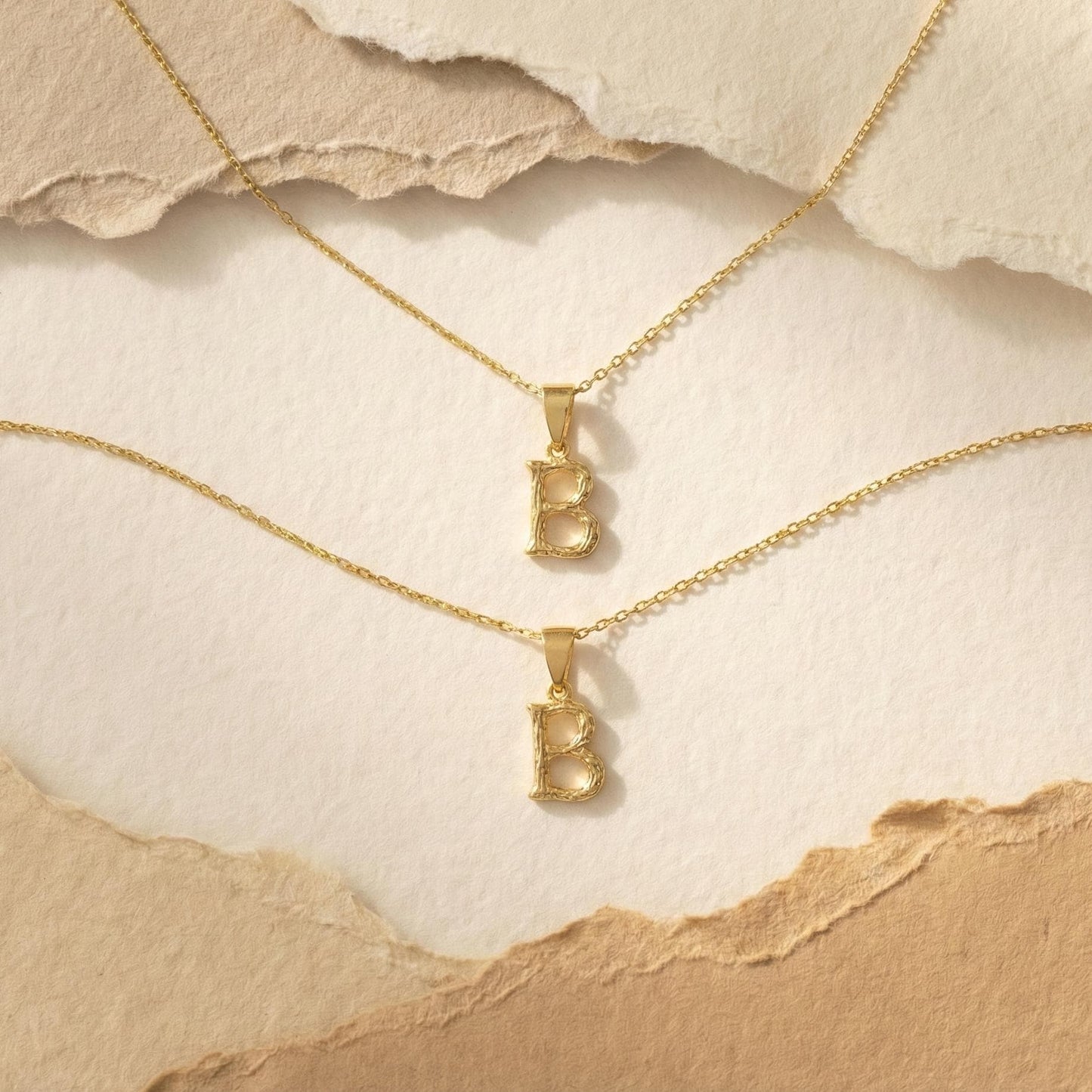 Gold color bamboo texture initial necklace letter pendant on model, minimalist personalized jewelry for mothers day gift.