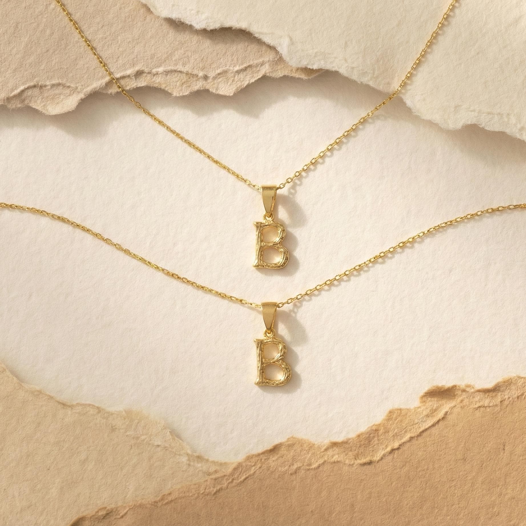 Gold color bamboo texture initial necklace letter pendant on model, minimalist personalized jewelry for mothers day gift.