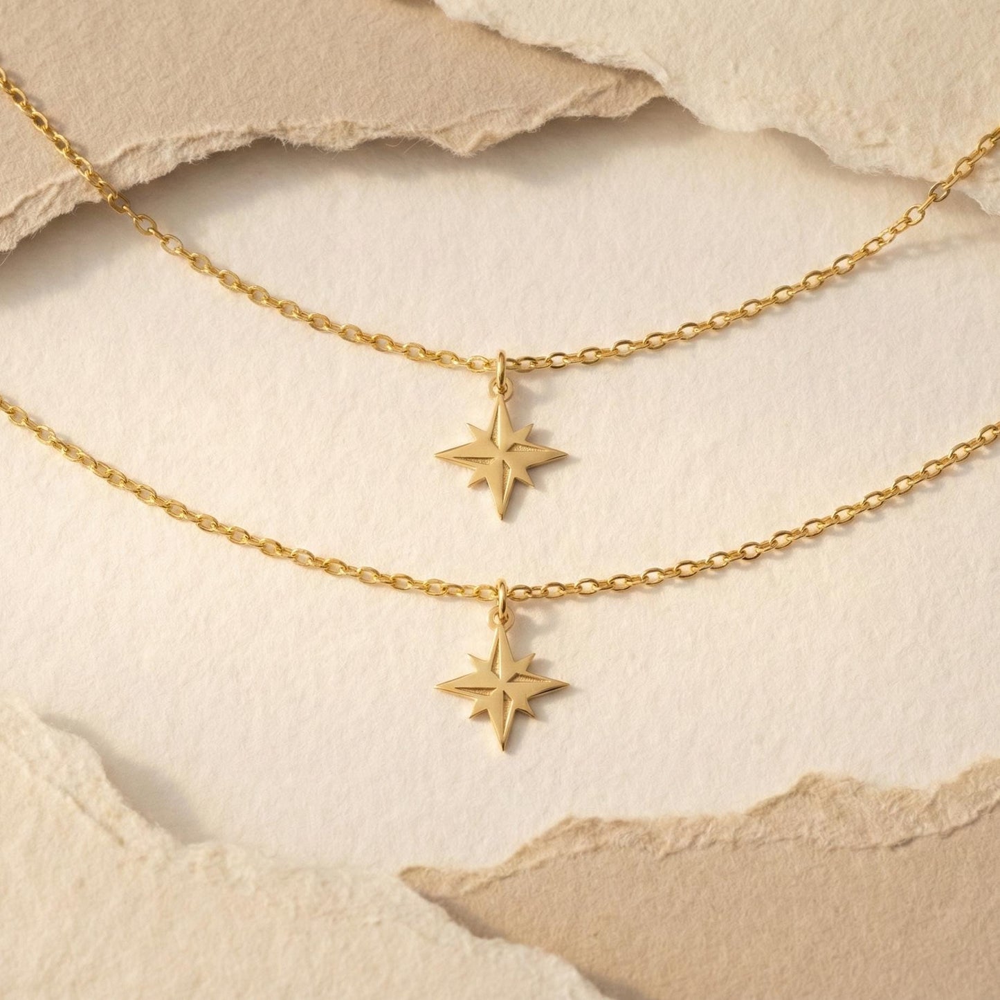 Gold North Star necklace on model, minimalist celestial jewelry pendant, eight-pointed starburst charm necklace, dainty layering necklace gift for her, mothers day and graduation jewelry gift idea