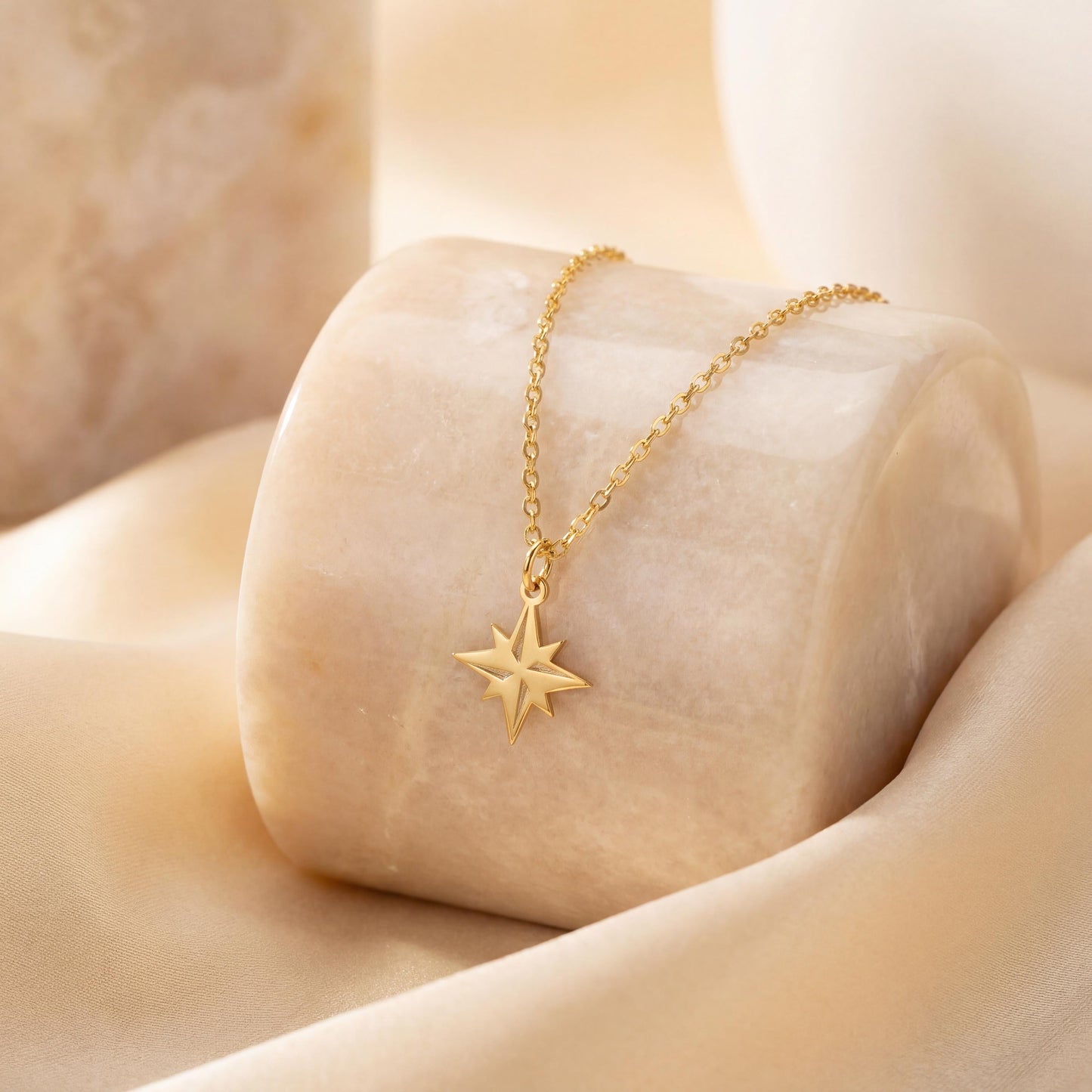 Gold North Star necklace on model, minimalist celestial jewelry pendant, eight-pointed starburst charm necklace, dainty layering necklace gift for her, mothers day and graduation jewelry gift idea