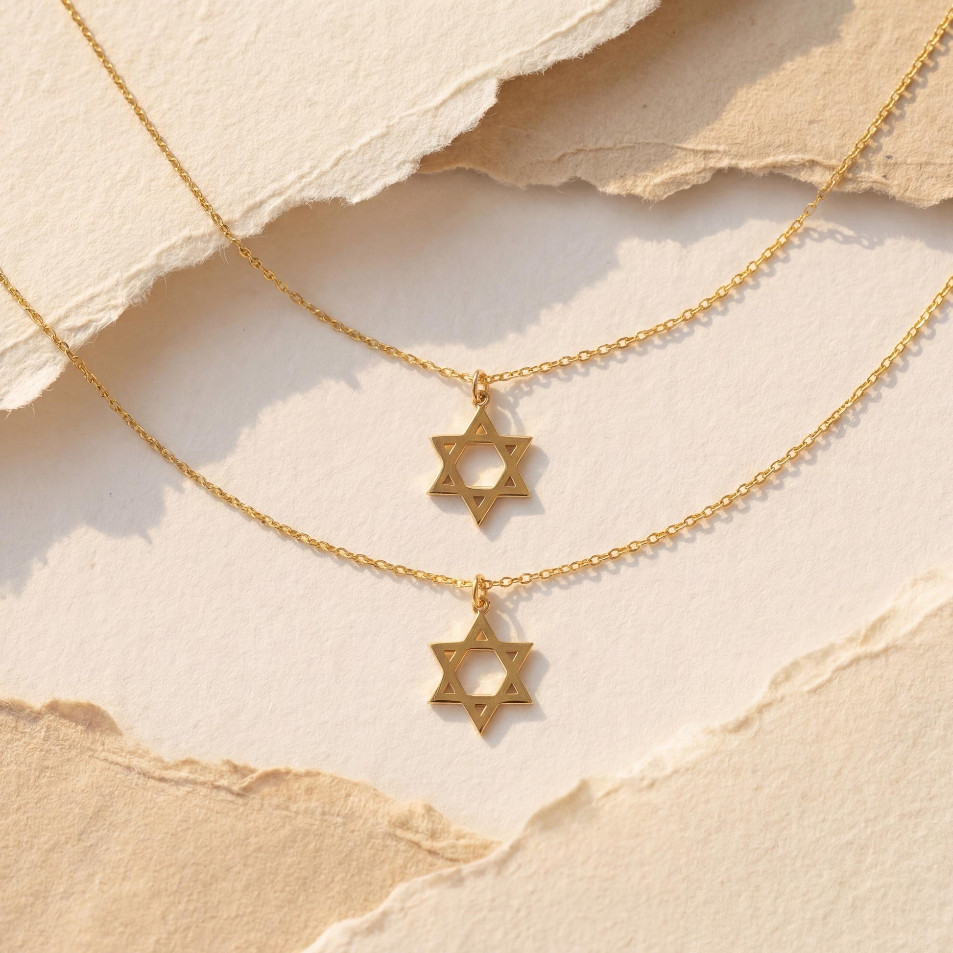 Minimalist gold Star of David pendant necklace on a woman's neck, dainty Magen David Jewish jewelry gift for Bat Mitzvah and Mother's Day.