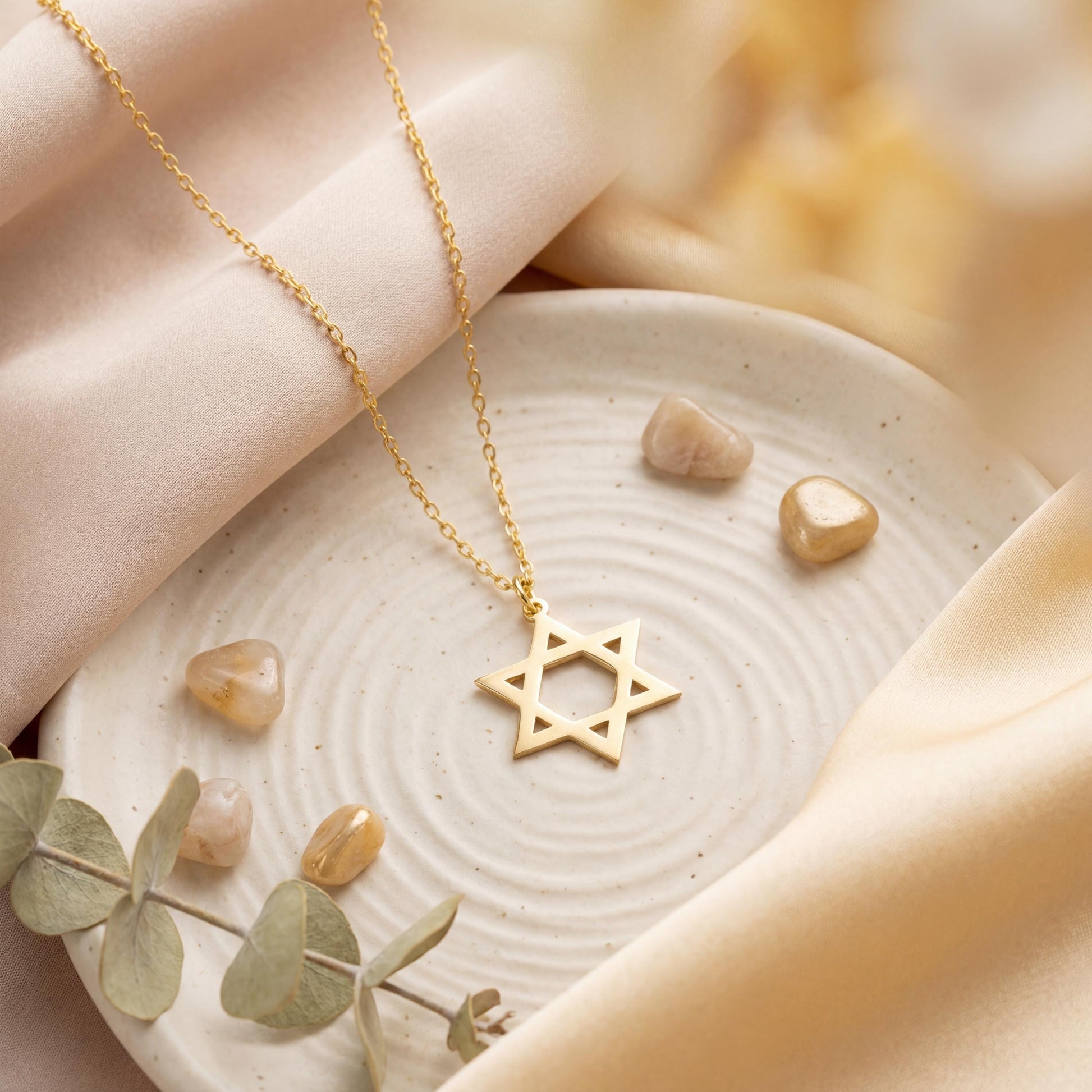 Minimalist gold Star of David pendant necklace on a woman's neck, dainty Magen David Jewish jewelry gift for Bat Mitzvah and Mother's Day.