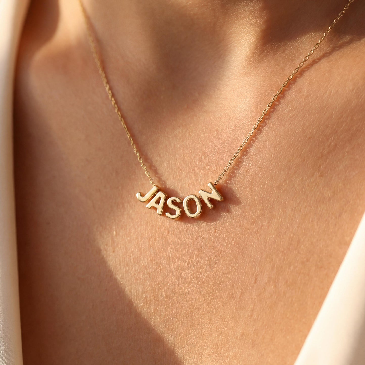 Dainty custom name necklace, elegantly worn by a woman, perfect personalized minimalist jewelry gift for Mother's Day