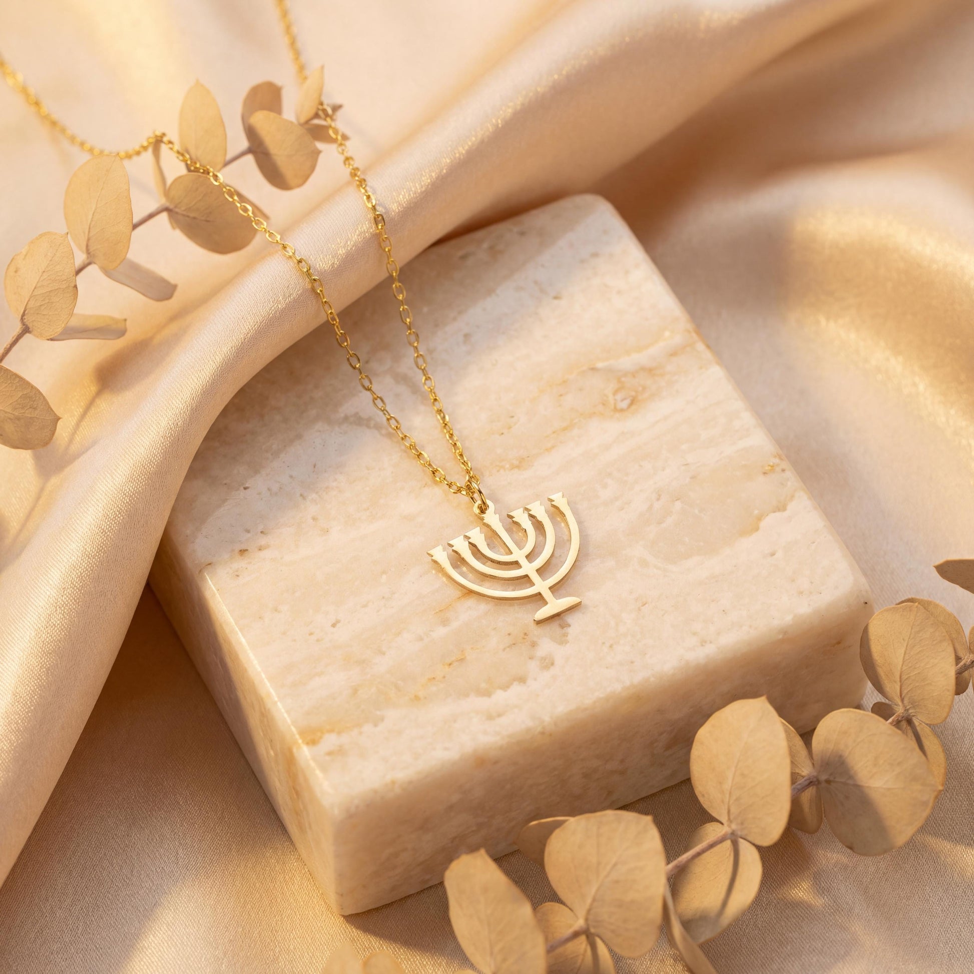 Dainty 14K gold plated minimalist Menorah necklace worn by a woman, elegant Jewish Judaica pendant jewelry ideal for Mother's Day or Bat Mitzvah gift.